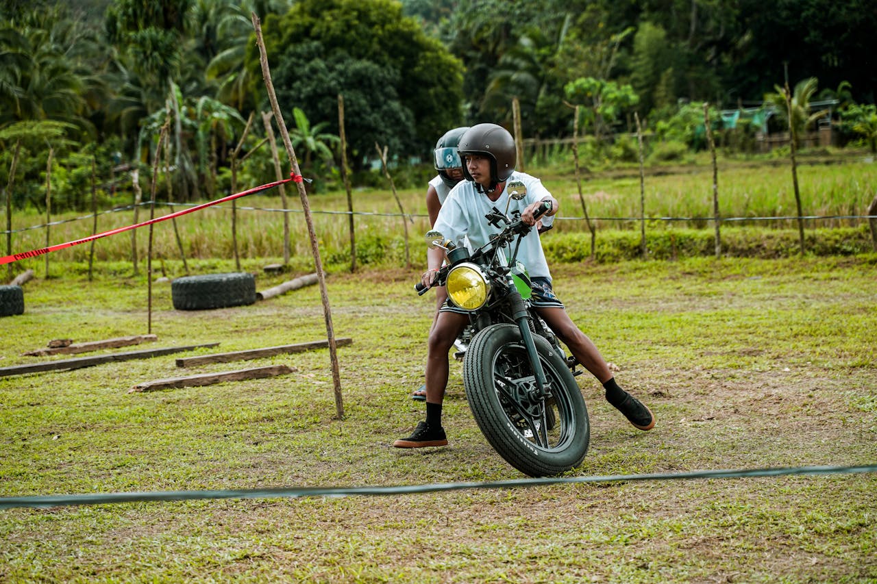 Mastering the First Impression: Your intriguing post title goes here Two young men training on a motorbike track in rural Tanay field.