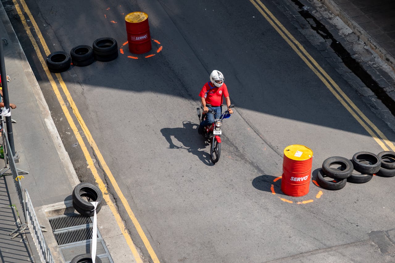 Crafting Captivating Headlines: Your awesome post title goes here Motorcyclist navigating a strategic urban training course with cones and barriers.